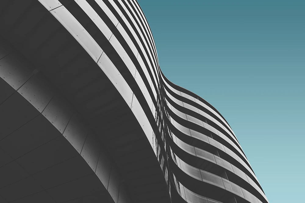 Low angle shot of a modern building with large glass windows